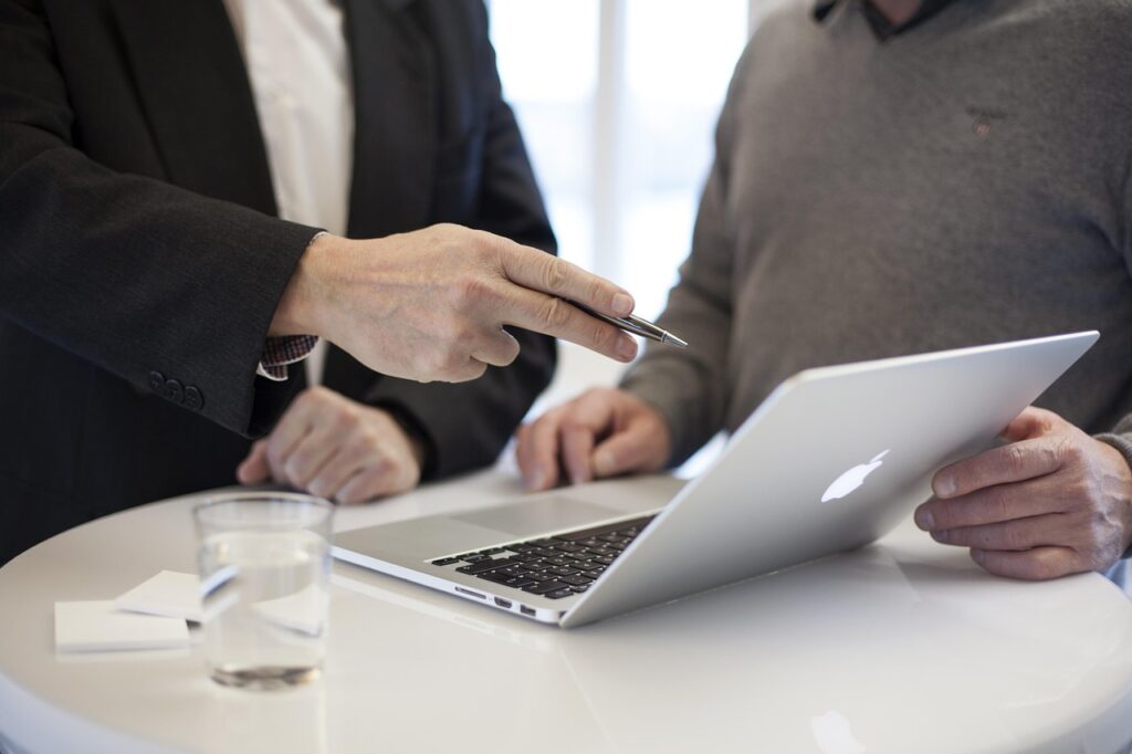 Business consultant shaking hands with client