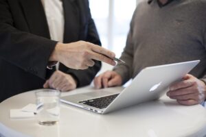 Business consultant shaking hands with client