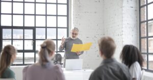 A leader speaking seriously to their team during a period of change