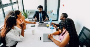 Diverse NGO team in a collaborative business meeting in a Lagos office
