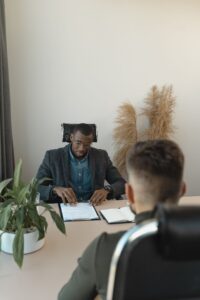 Candidate being interviewed for an NGO role in a modern office