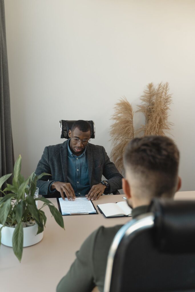 Candidate being interviewed for an NGO role in a modern office