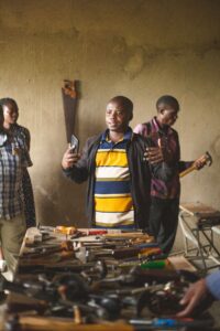 Adults engaged in a community workshop session in Uganda