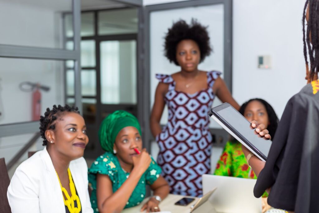 African women collaborating in an office meeting on a project plan